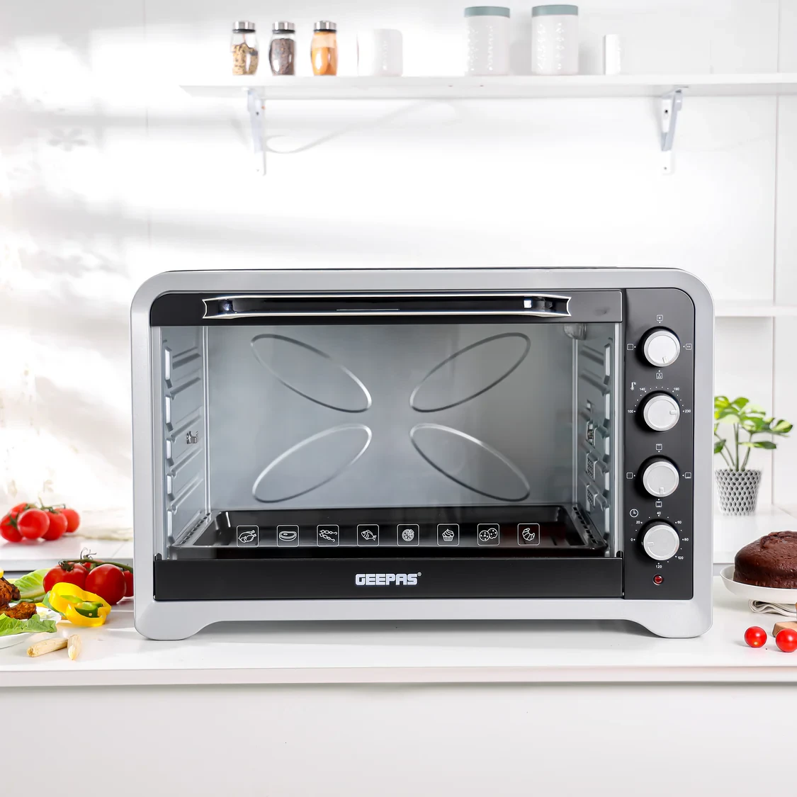 Geepas Electric Oven GO4402N has an 80-liter capacity and uses 2400 watts of power. It includes both rotisserie and convection functions. The oven has four heating stages and allows for adjustable tem